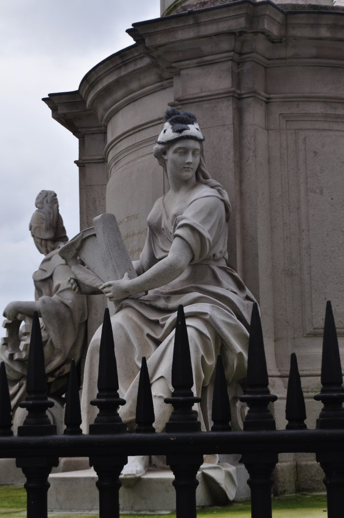a statue that was cold and chose to cover her head...